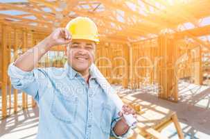 Hispanic Male Contractor with Blueprint Plans Wearing Hard Hat