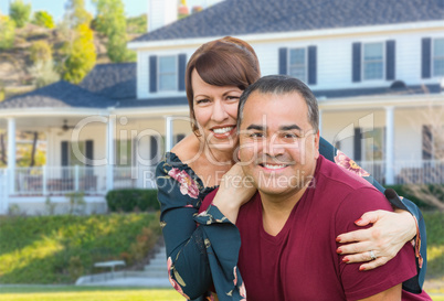 Mixed Race Young Adult Couple Portrait In Front of Beautiful House