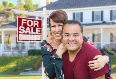 Mixed Race Young Adult Couple In Front of House and For Sign