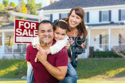 Happy Mixed Race Family In Front of House and For Sale Sign