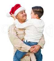 Hispanic Male Soldier Wearing Santa Cap Holding Mixed Race Son