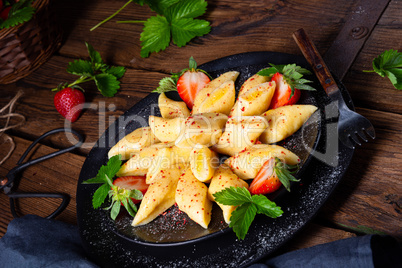 Kopytka - polish potato dumpling with strawberries