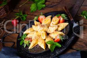 Kopytka - polish potato dumpling with strawberries