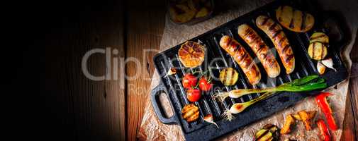 Delicious  grilled sausage with various grilled vegetables