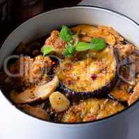 Veal goulash with baked aubergine and herbs