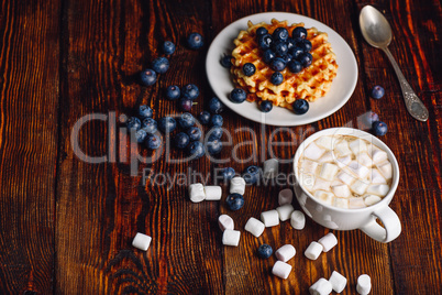Cup of Cocoa and Waffles with Blueberry.