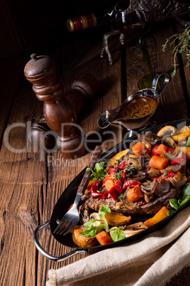 tender beef topped with various vegetables