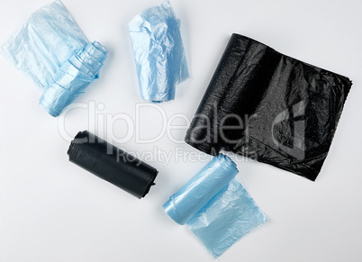 black and blue plastic bags for trash can on a white background