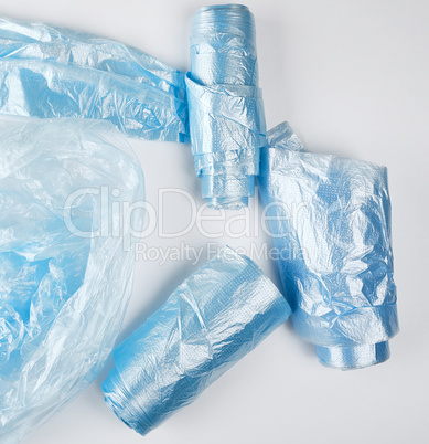 blue plastic bags  for garbage on a white background