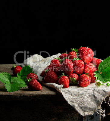 fresh ripe red strawberries on a gray linen napkin