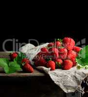 fresh ripe red strawberries on a gray linen napkin