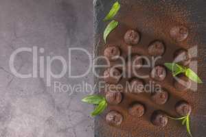 Top view of chocolate truffles powdered with cocoa