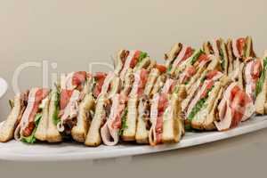 Club sandwich with turkey, bacon, tomato and bread