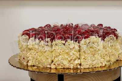 Raspberry and almond chocolate cake, sliced and ready for desser