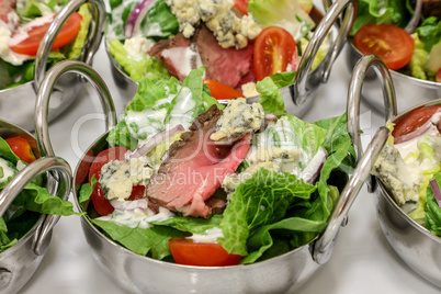 Steak and blue cheese spring green salad