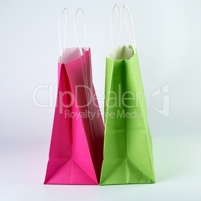 rectangular pink and green  paper shopping bags with a handle