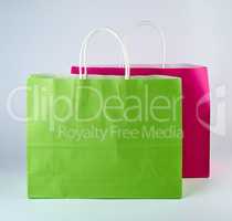 rectangular pink and green  paper shopping bags with a handle