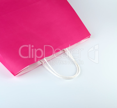 pink paper shopping bag with a handle