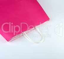 pink paper shopping bag with a handle