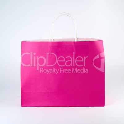 rectangular pink paper shopping bag with a handle