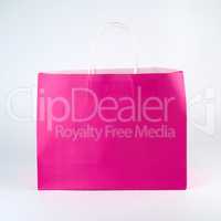 rectangular pink paper shopping bag with a handle