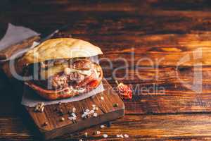 Homemade Burger on Cutting Board.