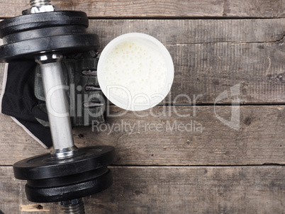 Protein shake with dumbbell, top view