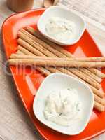 Organic cream cheese with herbs served with snacks