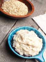 Tasty organic porridge in a blue bowl