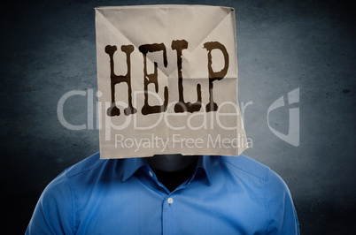 Businessman with a paper bag on ahis head