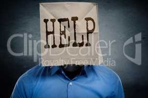 Businessman with a paper bag on ahis head
