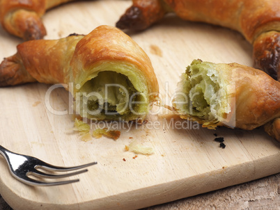 Croissants with matcha on wood