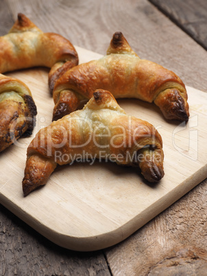 Croissants with matcha on wood