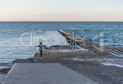 Pier on the beach in winter day