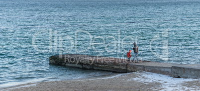 Pier on the beach in winter day