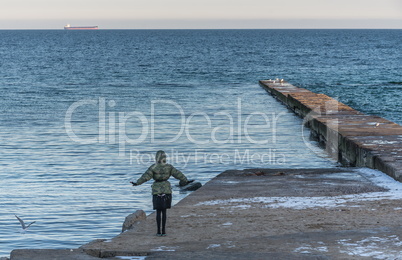 Pier on the beach in winter day