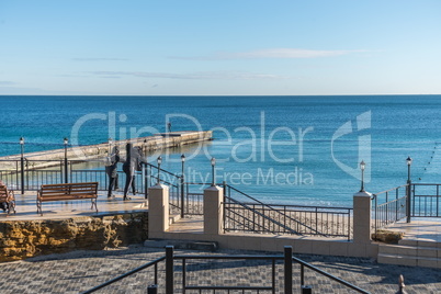 Pier on the beach in winter day