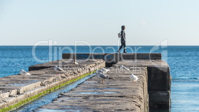 Pier on the beach in winter day