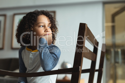 Boy sitting on chair in the lobby at hospital