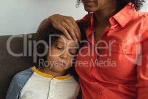 Mother consoling her son in the lobby at hospital