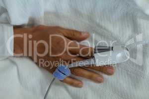 Pulse oximetry on patient hand in the ward at hospital