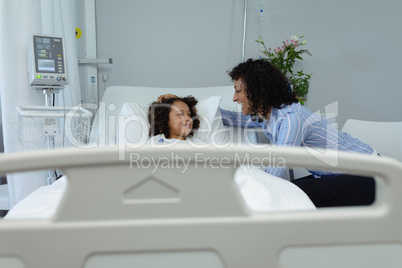 Mother interacting with her son in the ward at hospital