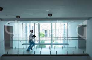 Female doctor running in the corridor at hospital