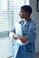 Female doctor holding a file in hospital