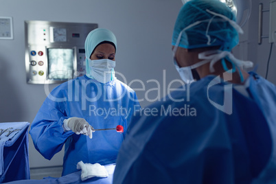 Female surgeons performing surgery in operation room