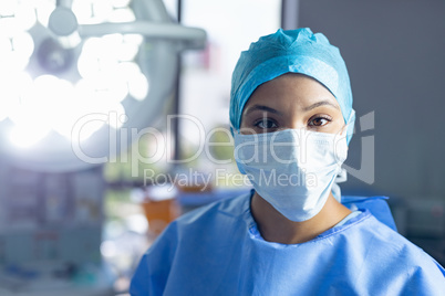 Female surgeon standing in operation room at hospital