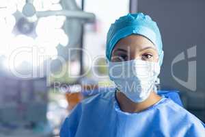 Female surgeon standing in operation room at hospital