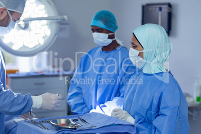 Surgeons performing surgery in operation room
