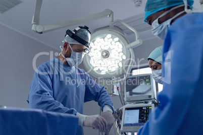 Surgeons performing surgery in operation theater