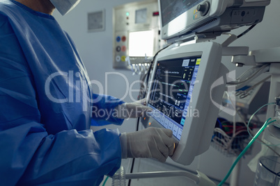 Surgeon using the medical monitor in operation theater at hospital
